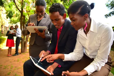 People look at a mobile device