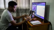 A man works at his computer