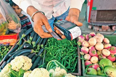 A merchant accepts a credit card payment in India. Photo: Narmada Dewasi, 2017 CGAP Photo Contest