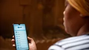 Woman uses platform app on mobile phone